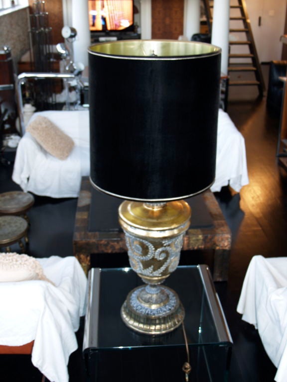 Wow! its huge! size does matter here!

This giant lamp has all the bells and whistles of a Fornasetti 