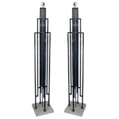 a pair of skyscraper floor lamps by D.I.A. After C. Jere