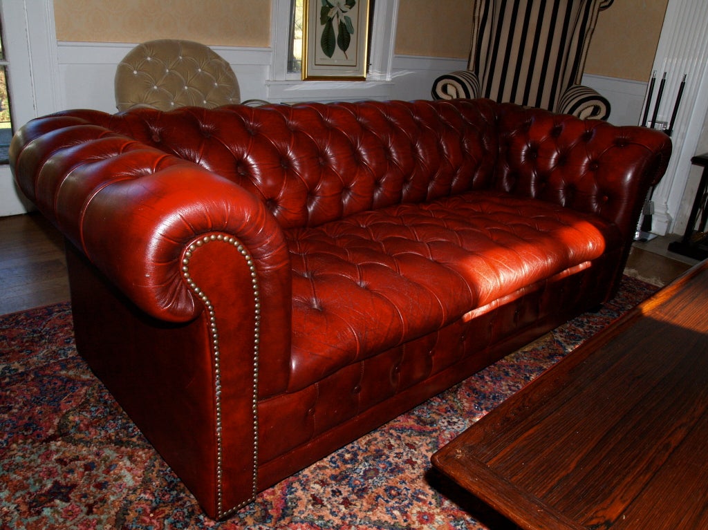 a great timeless piece. the ox blood chesterfield sofa. great worn in condition.
soft and supple leather. no holes or damage here. the preferred tufted seat and back model with the brass nail heads.