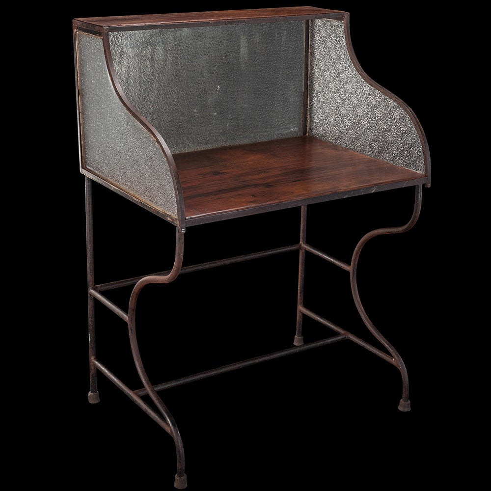 Unique bank desk with bent metal frame, walnut inserts and patterned glass.

Made in France, circa 1950.