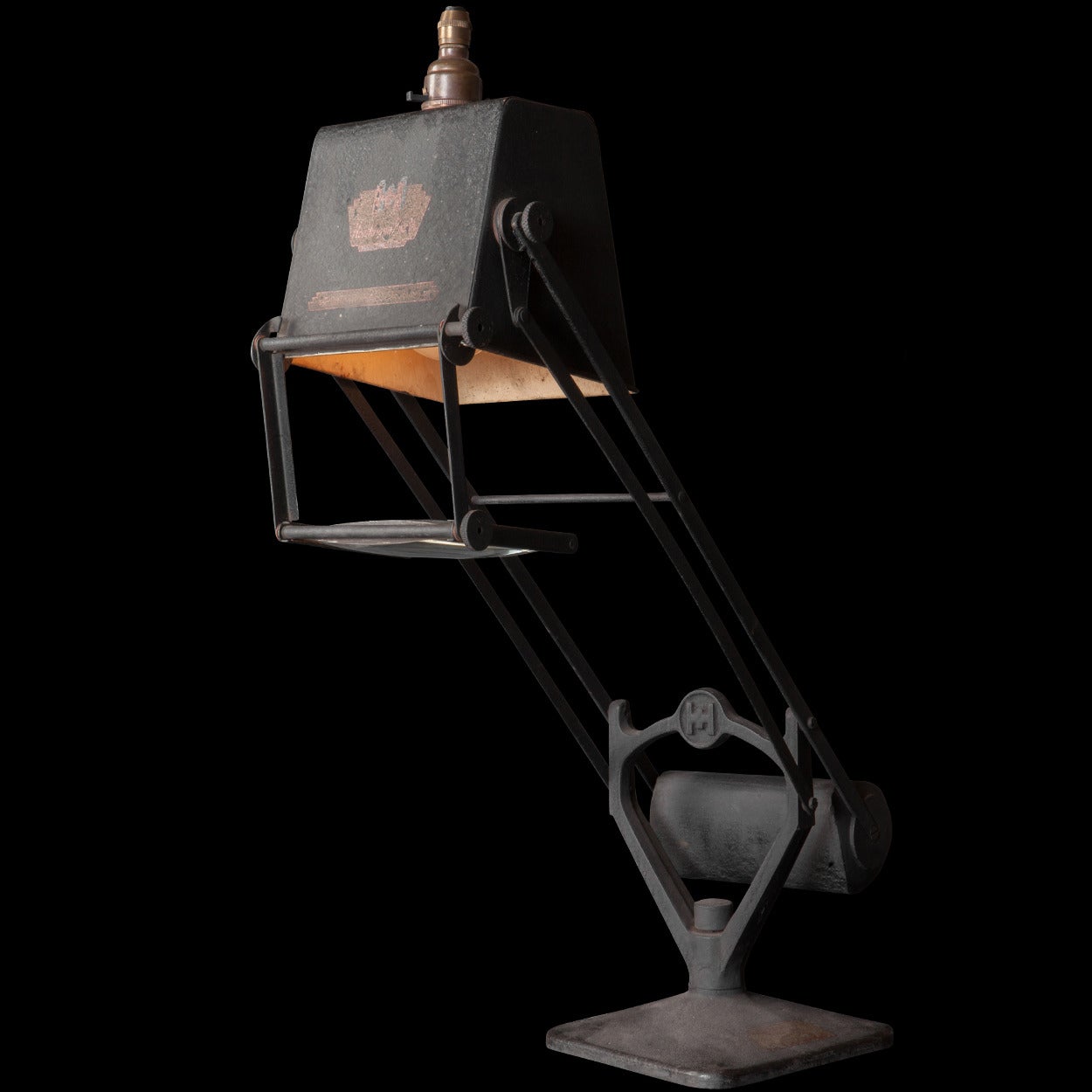 A unique desk lamp with magnifying lens, and barrel weighted counterbalance.

Completely original, with black jappaned finish, made in England circa 1920.