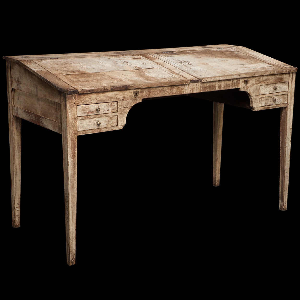 An early standing desk, with worn white paint and original brass hardware.

Made in France circa 1870.