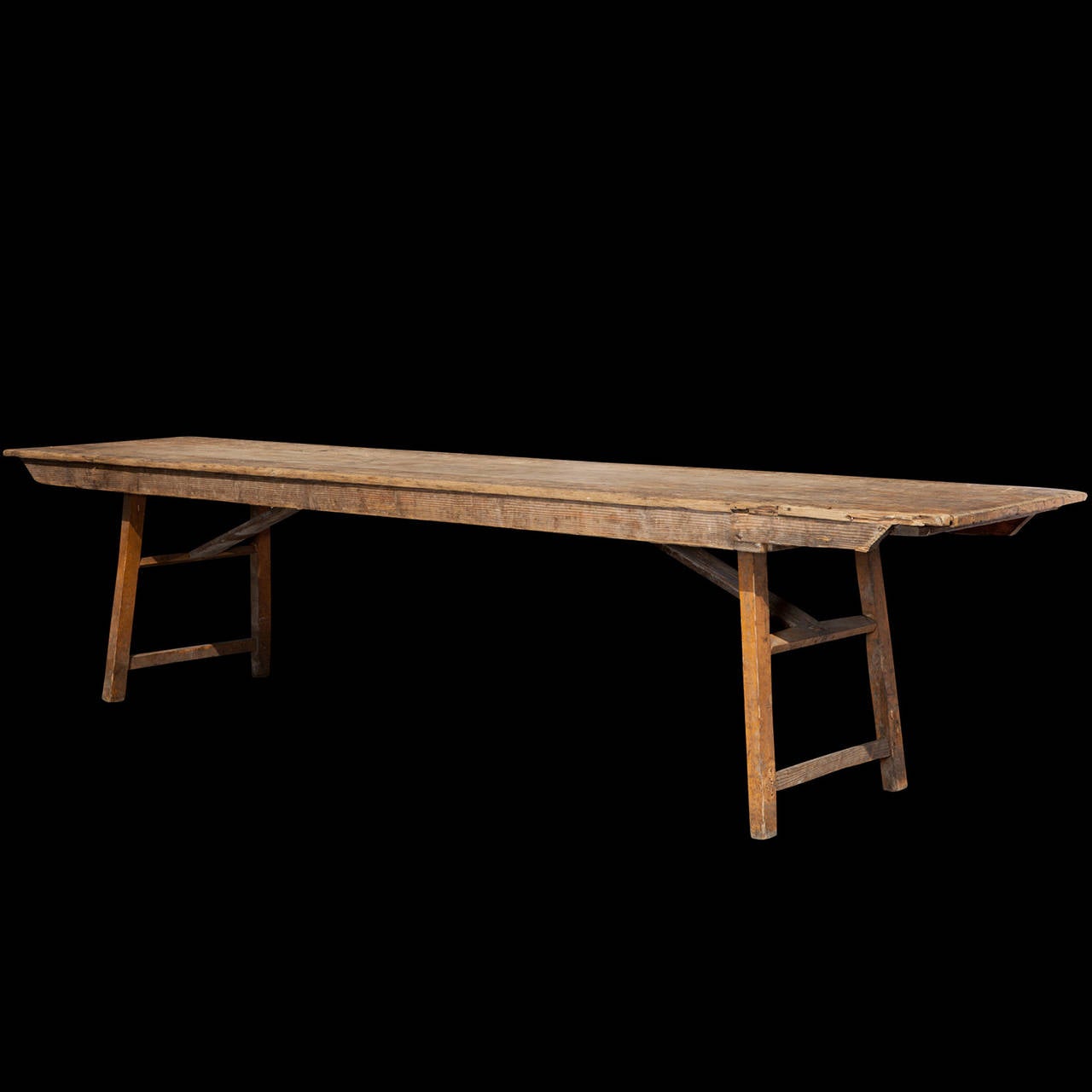 Solid pine harvest table, with folding legs.

Made in Italy circa 1910.