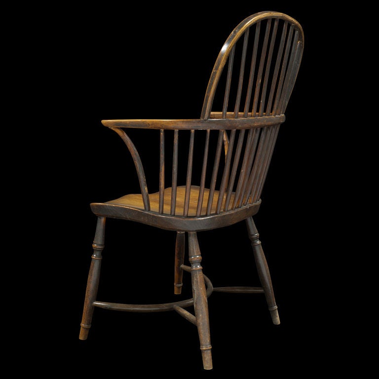 Comb back Windsor arm chair, hand carved seat, bentwood arms.