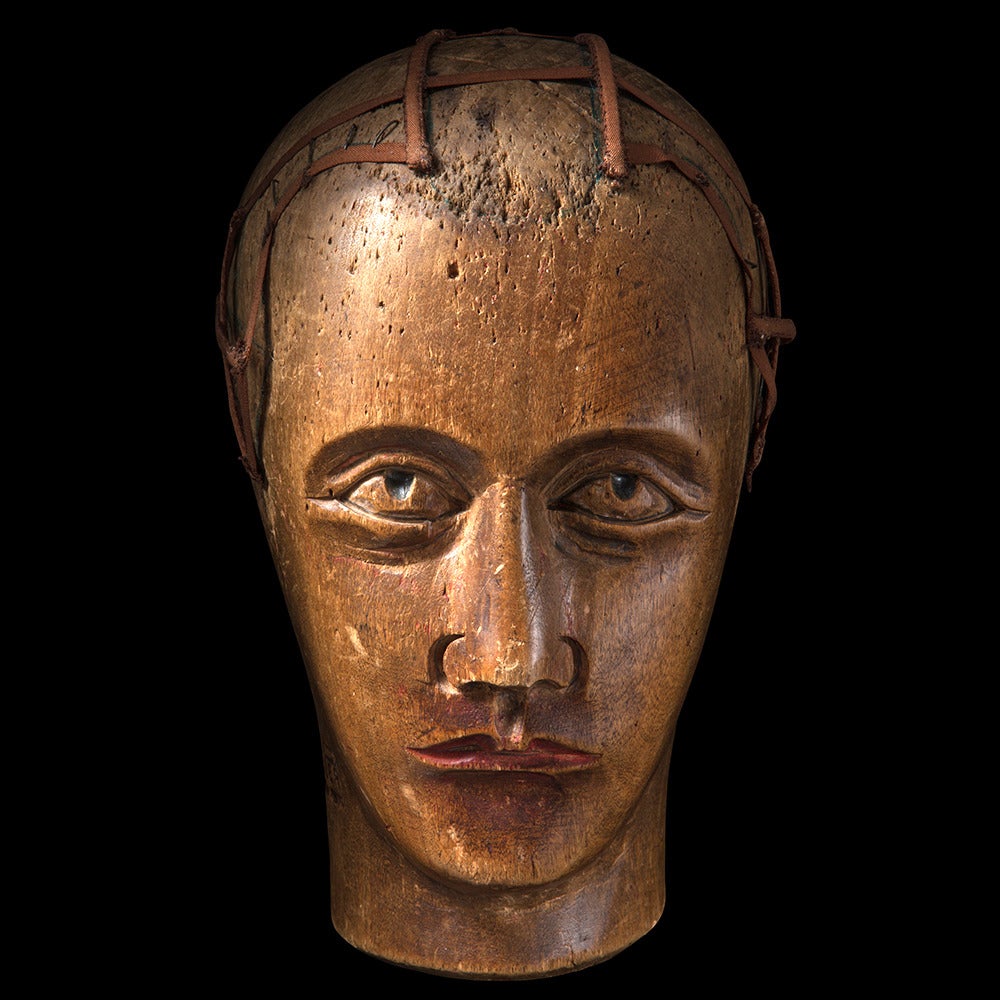 Sycamore mannequin head originally used by a hat maker.

Made in France, circa 1880 and marked 