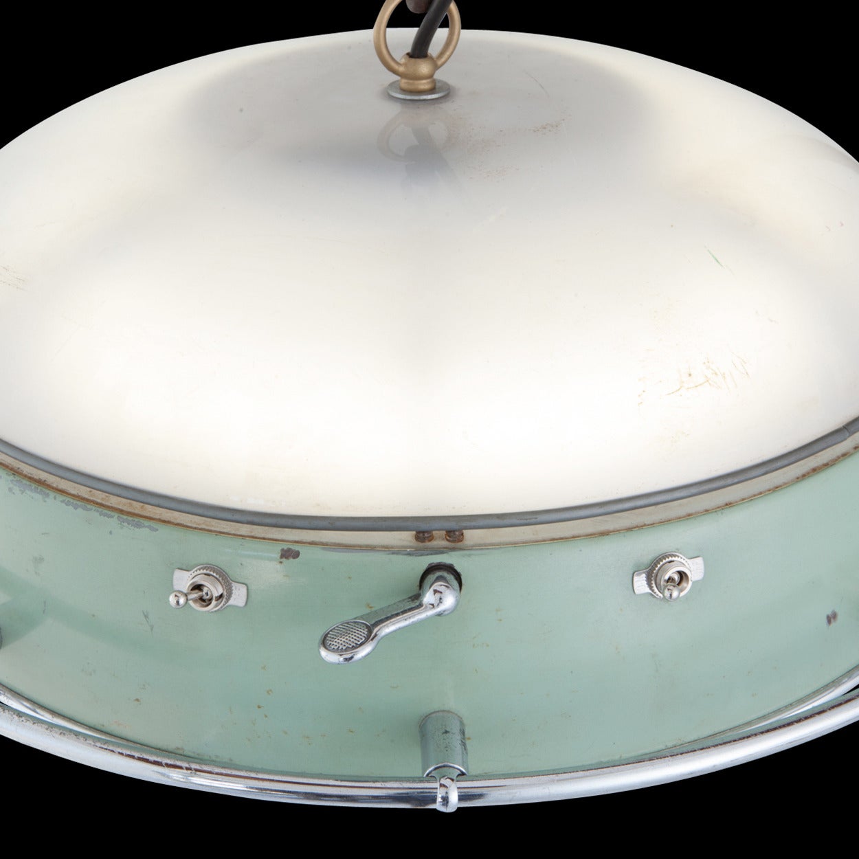 Pendant light with original green and cream paint. This light takes one circular halogen bulb and one standard socket bulb.

Made in England circa 1950.