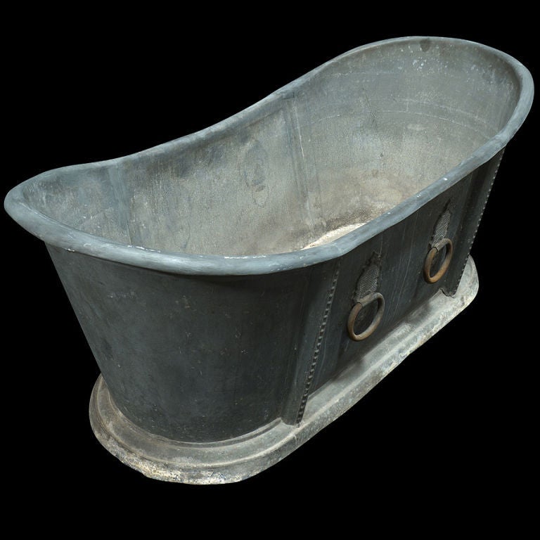 Zinc bath tub with original hardware classic form, wonderful patina.