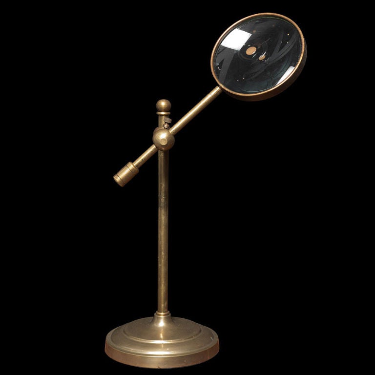 vintage magnifying glass on stand
