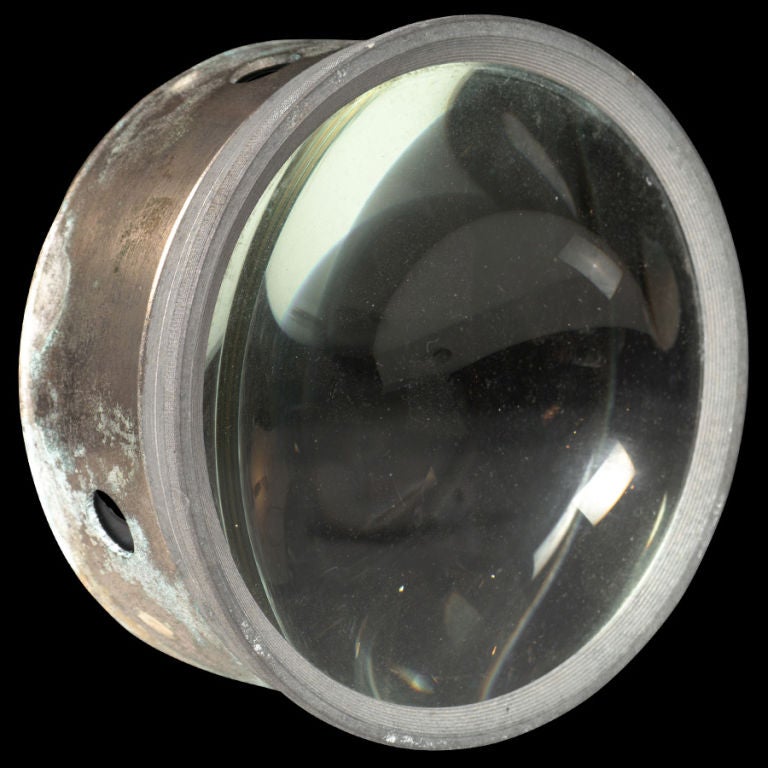 Magnifying Lens for a Vintage Magic Lantern Projector, encased in a bronze holder.