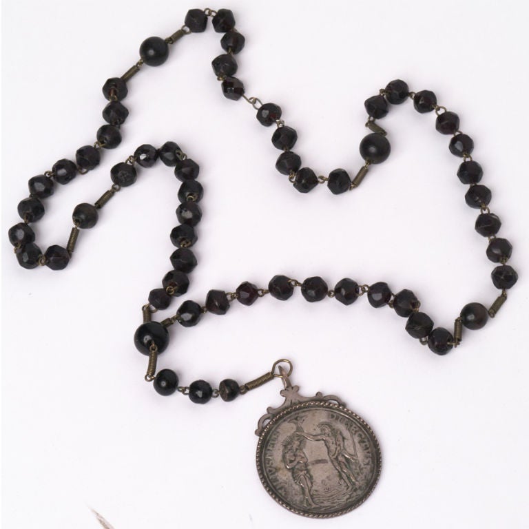 Monks Rosary with glass and wood beads, medallion of pressed silver.
