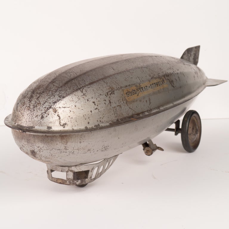 1930's Steelcraft Graf Zeppelin Goodyear Blimp, child's pull toy, with original wheels/caster