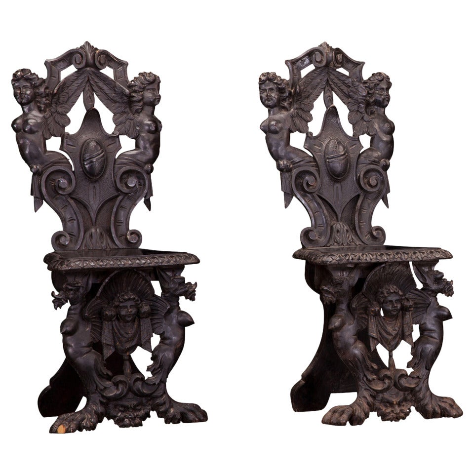 Ornately Carved Black Chairs