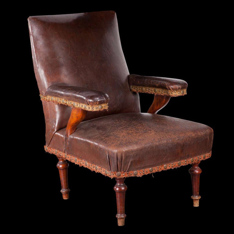 Victorian Leather Campaign Chair, solid oak frame, fitted with brass nails.

England circa 1870