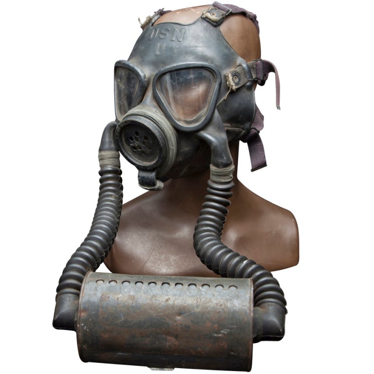 WWII Gas Mask with double hoses running to a single canister,
included is a female mannequin head