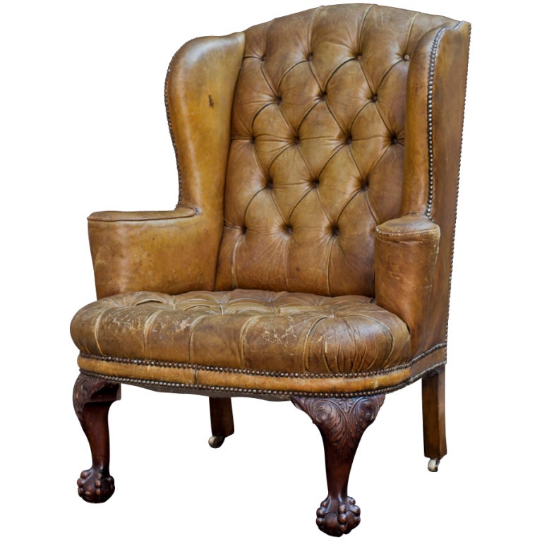 Tufted leather wingback, original olive leather, buttoned seat and back