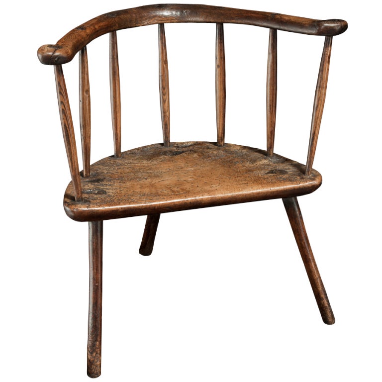 Three legged primitive windsor chair comprised of ash and sycamore, scrolled simple back