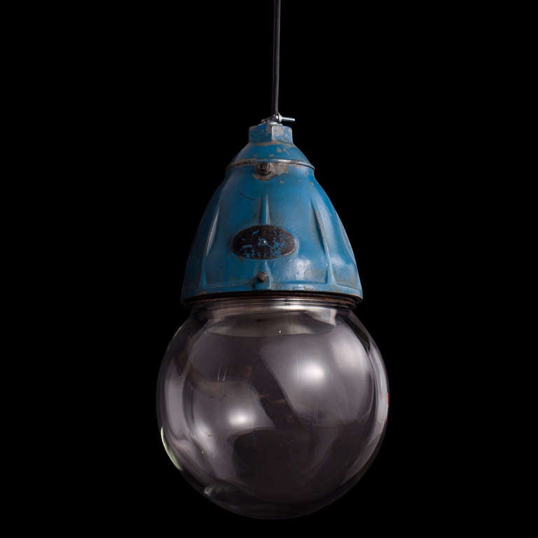 Factory light with heavy iron fitter, in original blue paint and a thick glass globe.

Type II G Lighting Fixture from the Benjamin Electric MFG Co., in Desplaines, IL.