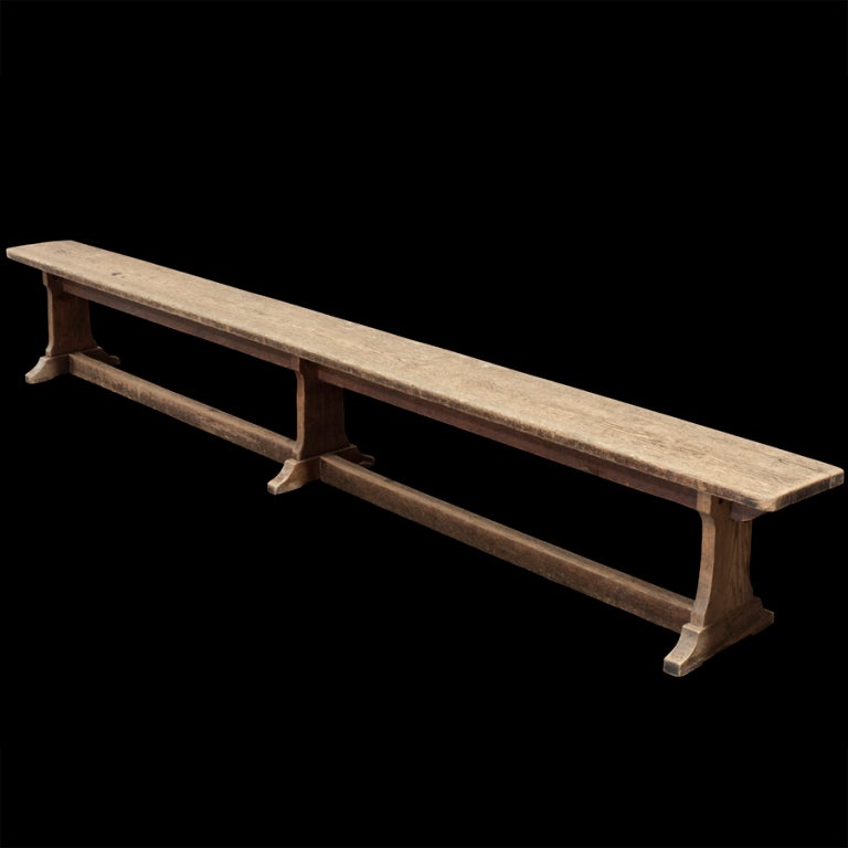 Primitive farm bench with bootjack feet, simple form