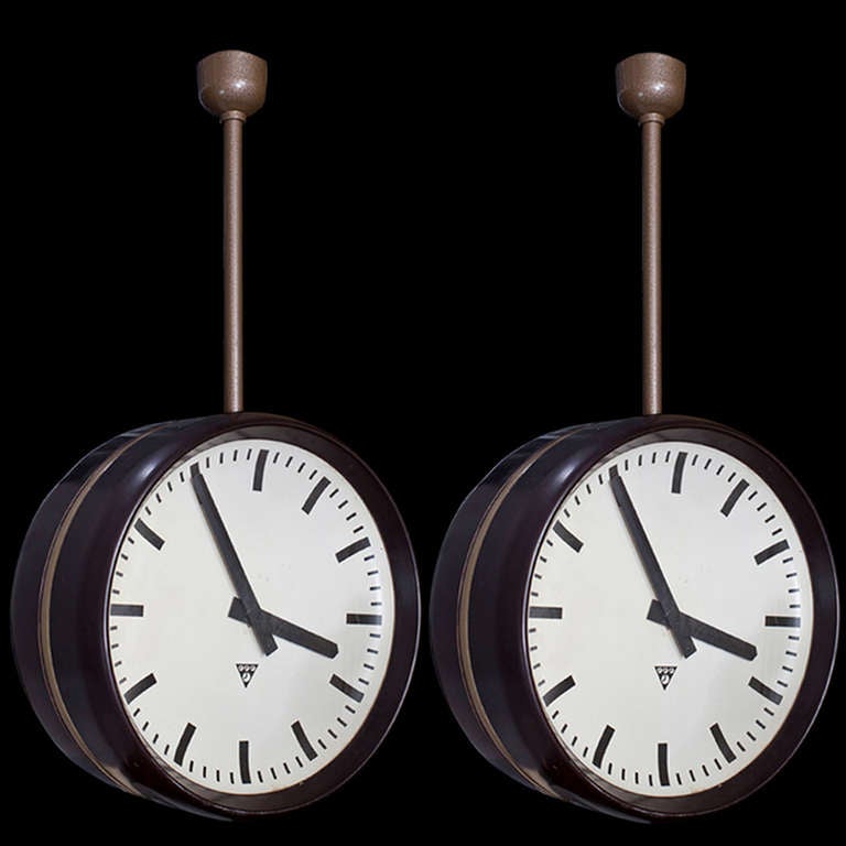 Unusual ceiling mount clock with simple face and hands