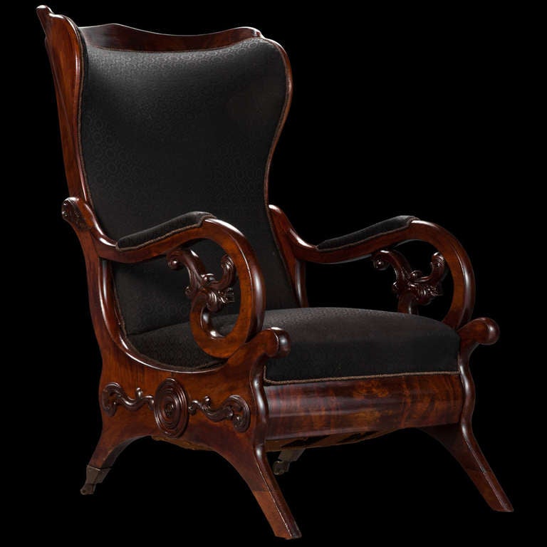 Early Victorian library chair, newly reupholstered with original mahogany frame.

England circa 1840