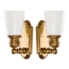 A Pair Of Shield-form Brass Sconces With Opal White Glass Shades