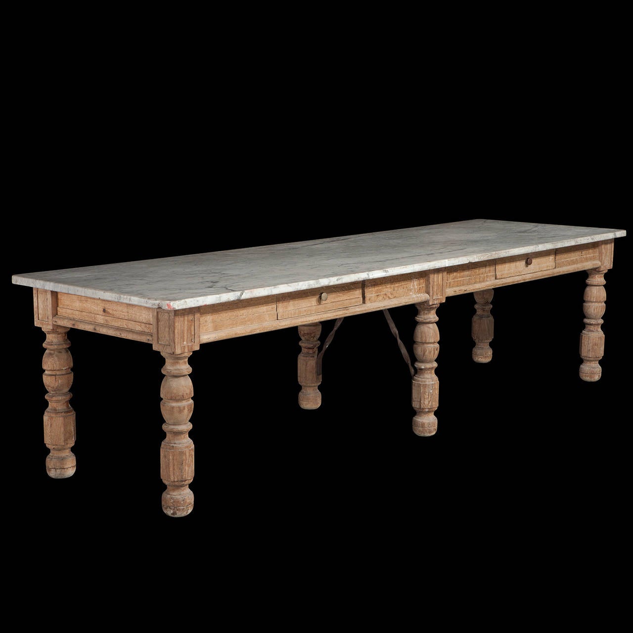 Solid oak frame with turned legs. The marble top provided a flat, cool surface for chocolate making.
