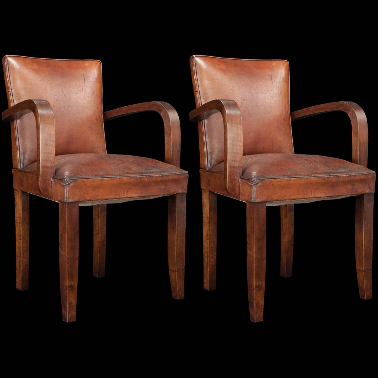 Bentwood arms and original leather upholstery with handsome patina.