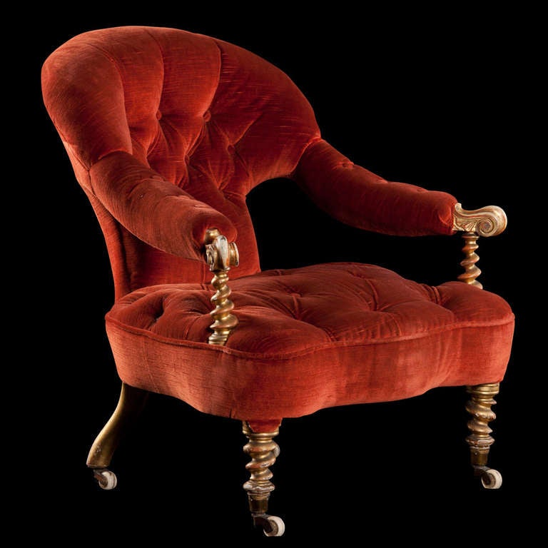 Red velvet on twist legs with brass hardware, unique design