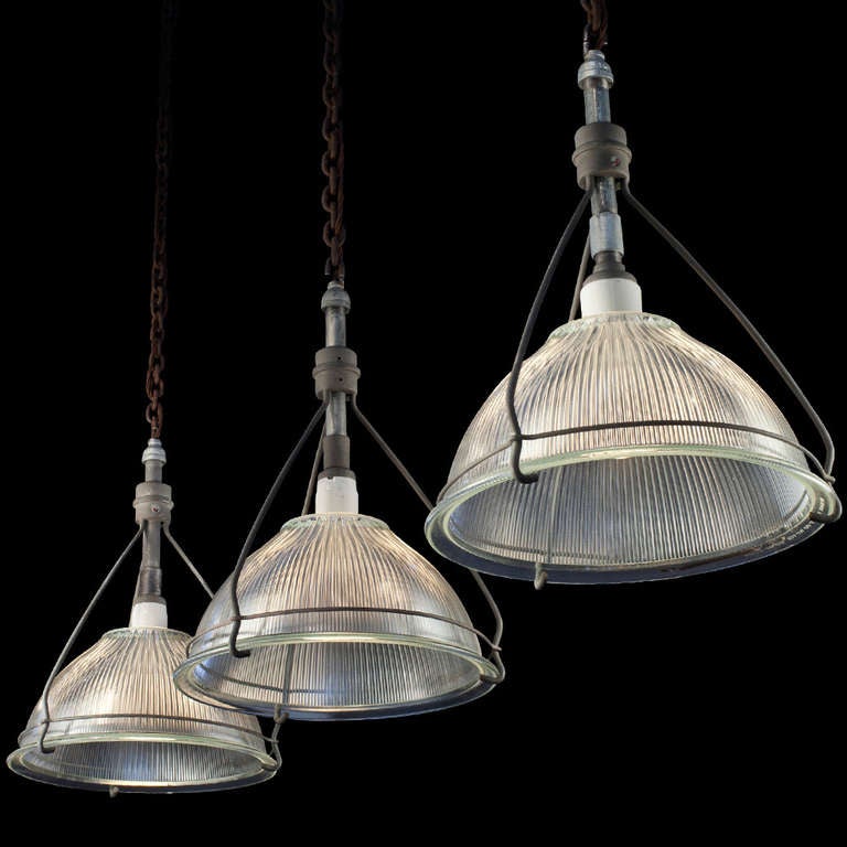 Simple form, skeletal metal fitter supporting ribbed halophane glass shade