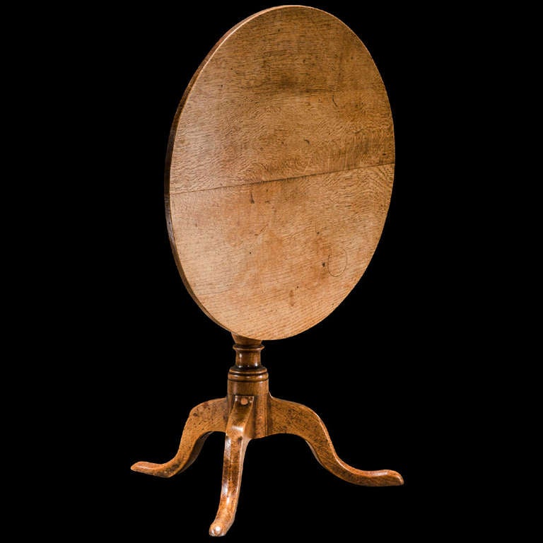 Simple oak cricket table with folding top. 

Made in England circa 1880.