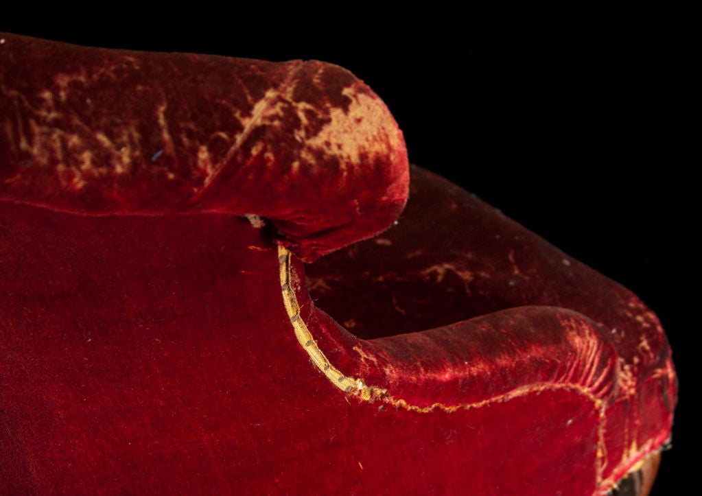 Red crushed velvet slipper chair with original wood feet.