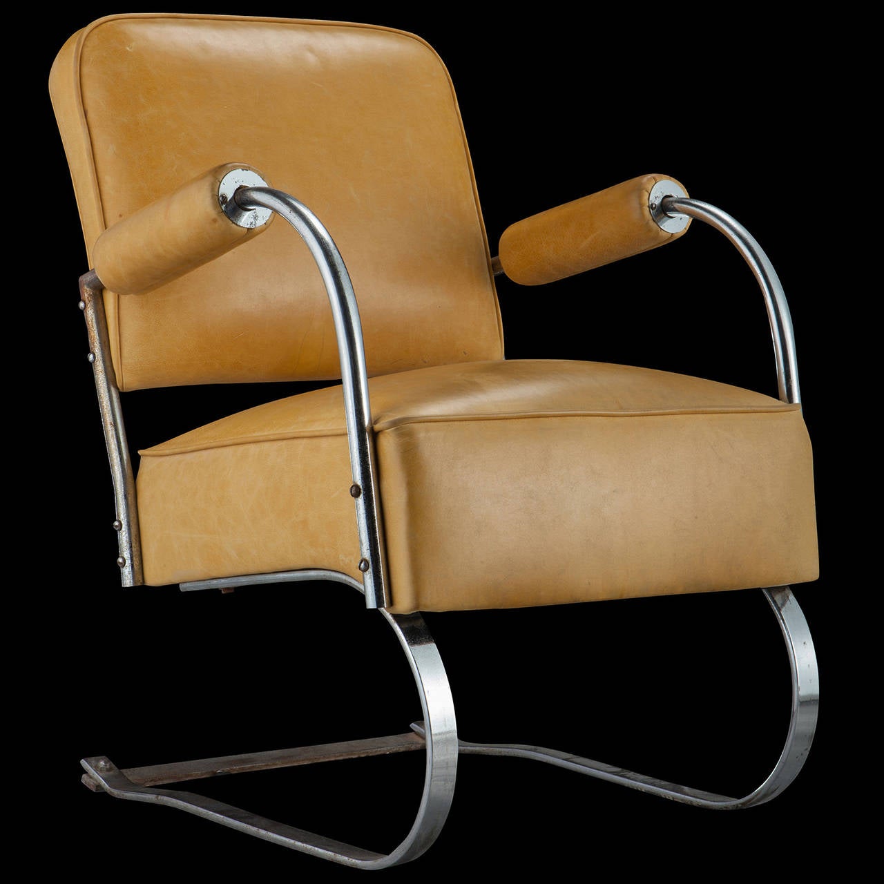 Steel cantilever frame with original leather upholstery.