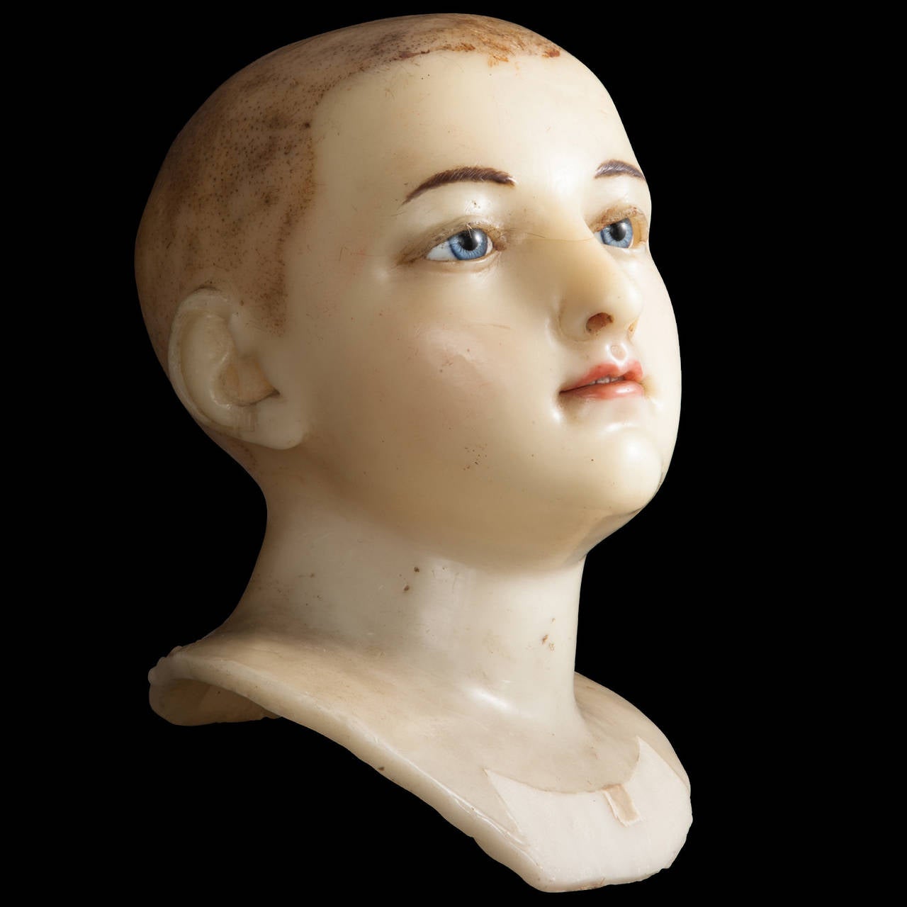 Wax head with glass eyes.