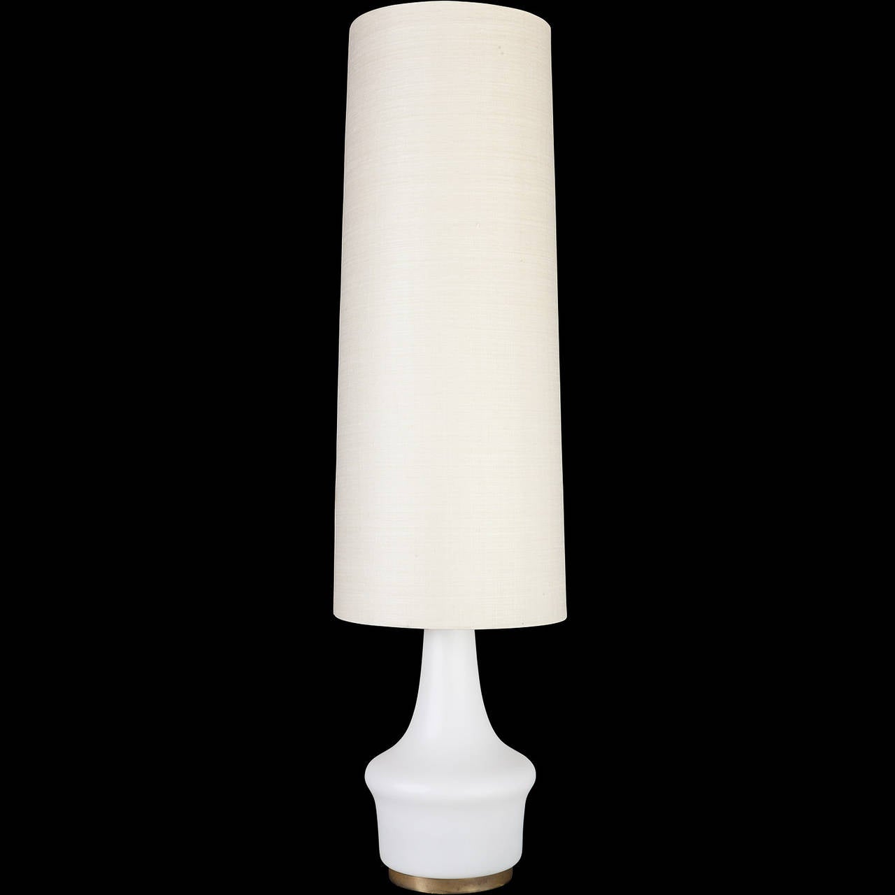 With tall shade and illuminating glass base.
