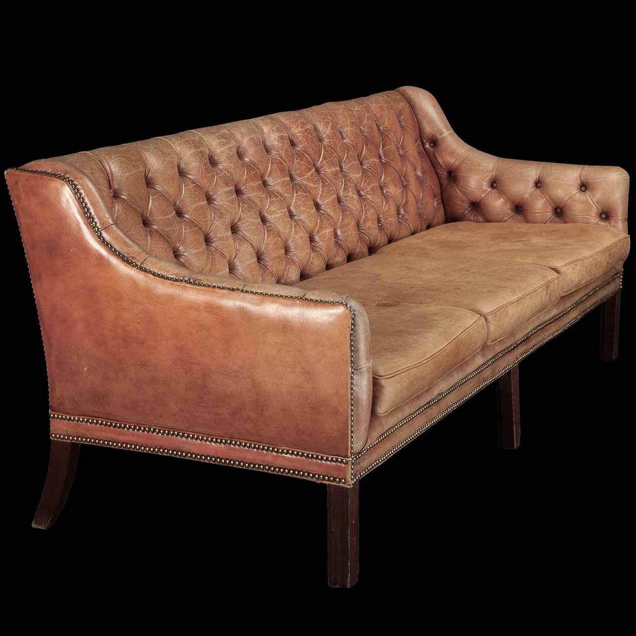 Original leather with beautiful patina on moulded mahogany legs.