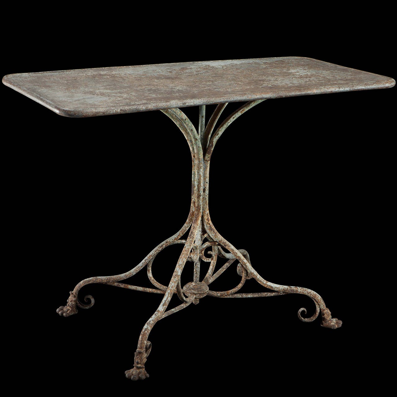 Simple table with ornate base and beautiful patina.