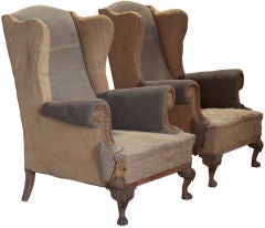 Pair of primitive tall wingback lounge chairs