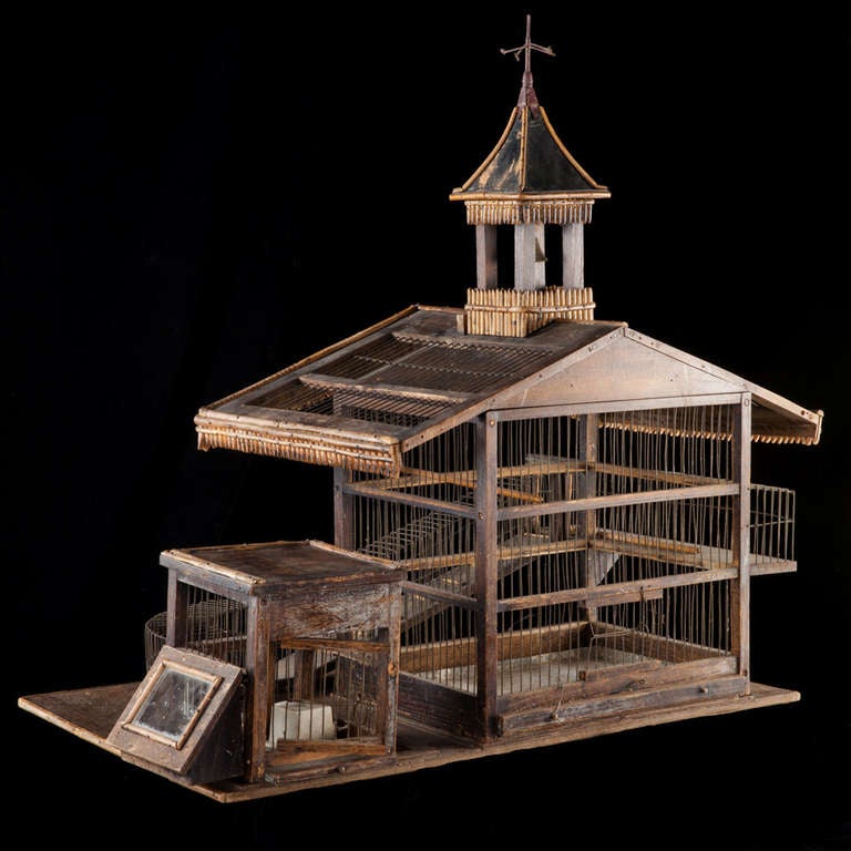 Beautifully designed bird cage in completely original condition, with feeding trough, ramp and bell tower.

Made in France circa 1890.