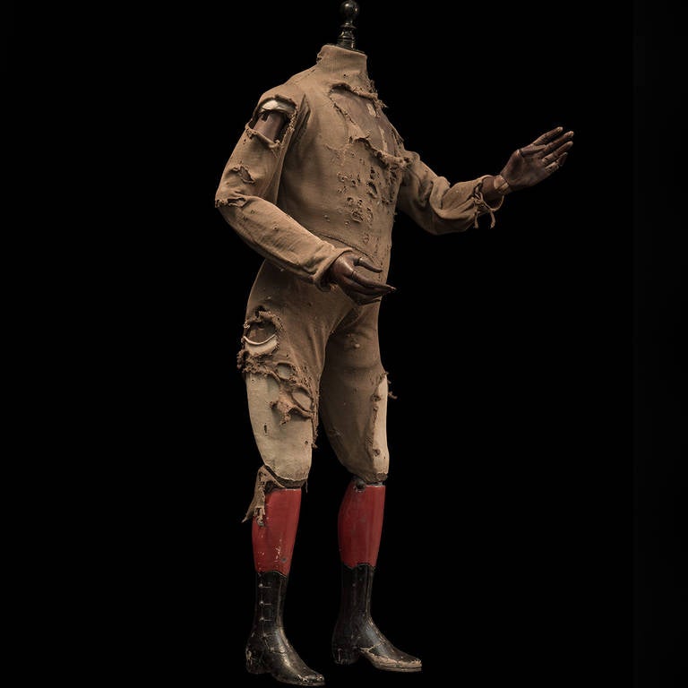 Wonderful pine figure, with original cotton clothing, red and black painted boots and articulated fingers.

Made in France circa 1870.