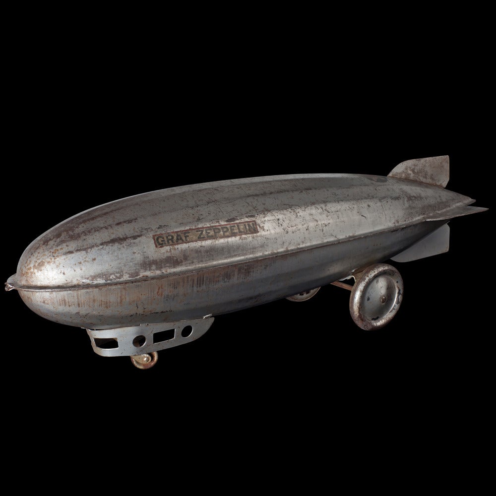 Graf Zeppelin toy dirigible, made with pressed steel. 

Manufactured by J.C. Penney Co. circa 1930.