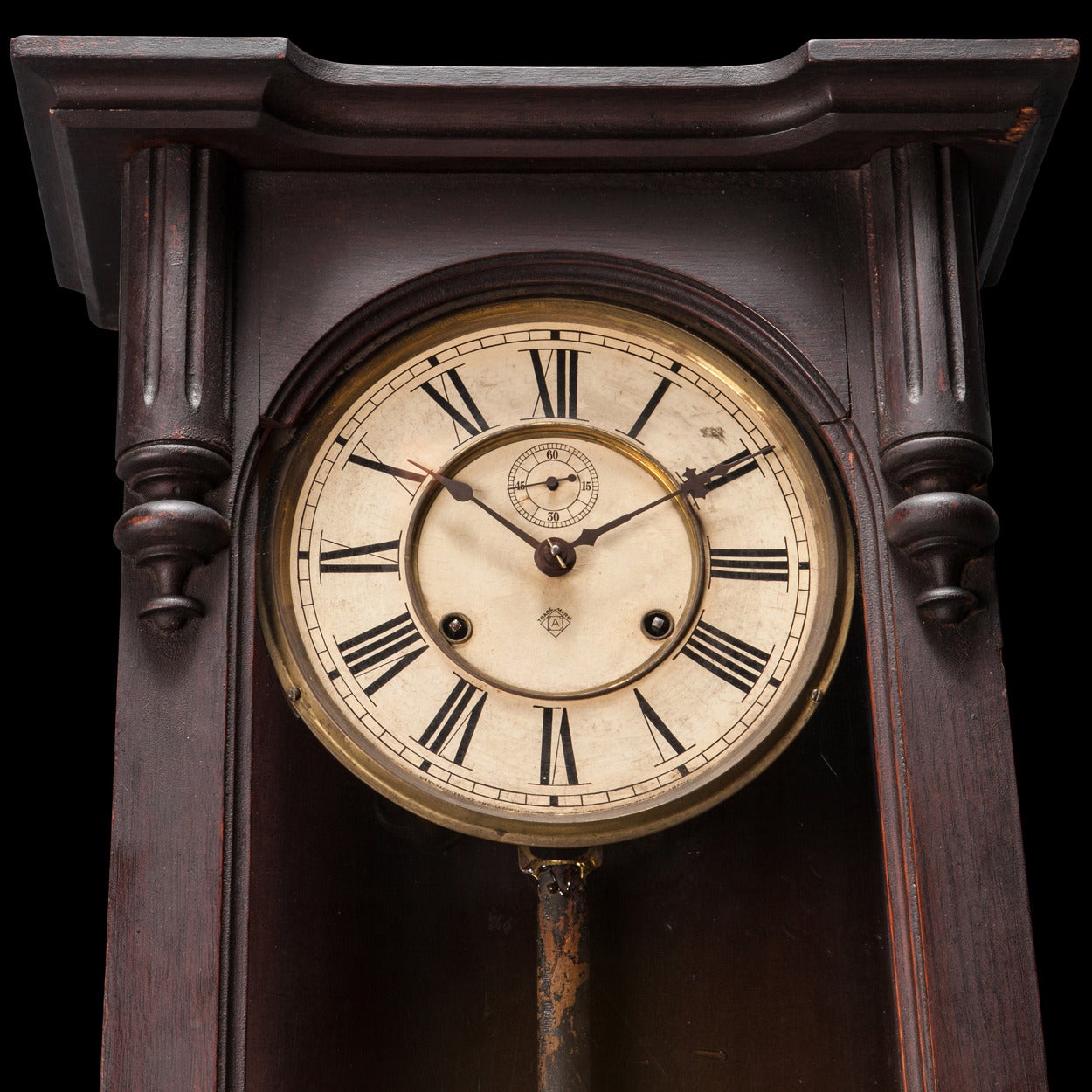 Pendulum clock in original walnut frame, with and painted face.

Manufactured by the Ansonia Clock Company in Brooklyn, NY circa 1900.