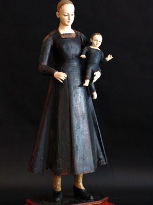 Santos, Virgin Mary with full bodied wood, carved black skirt, body and arms, rare ivory face and hands, delicately carved .