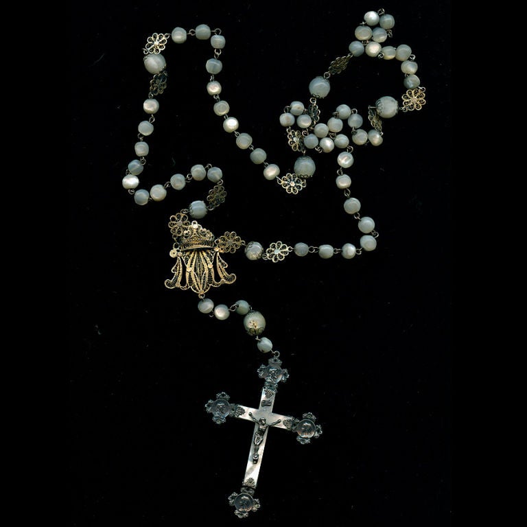 Victorian Mother of Pearl Rosary with silver filigree separations, interesting four point images on the cross.