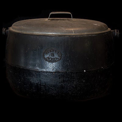 Large cast iron oval kettle with original lid and handle