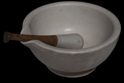 Mortar and Pestle from an early Apothecary with wood handle.