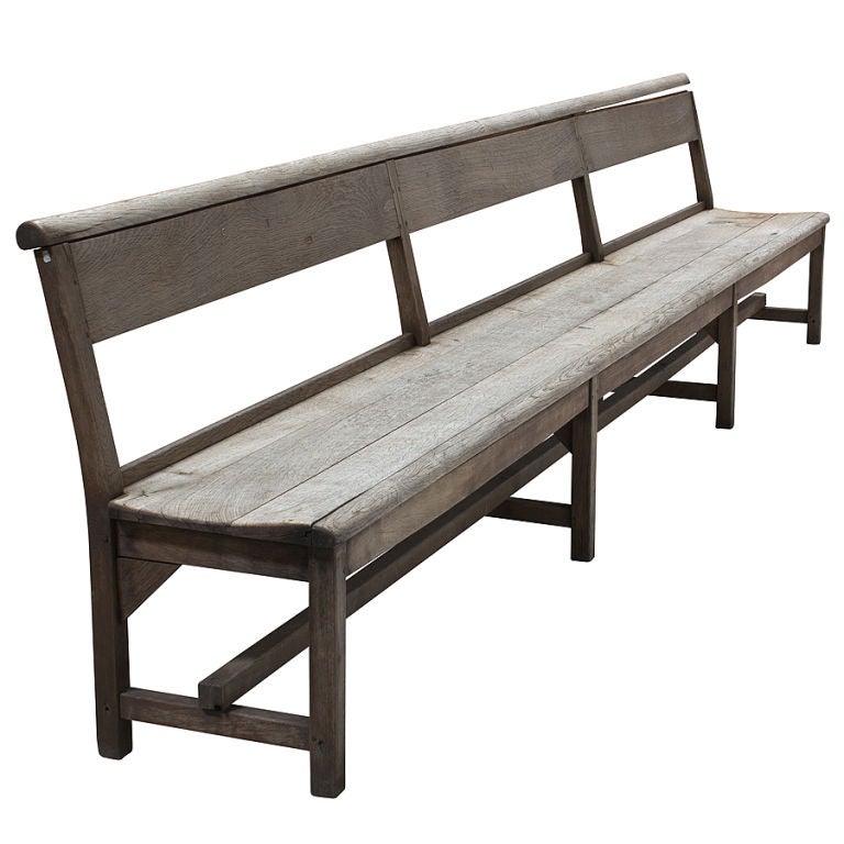 Outdoor long teak garden bench with simple form, long stretcher.
