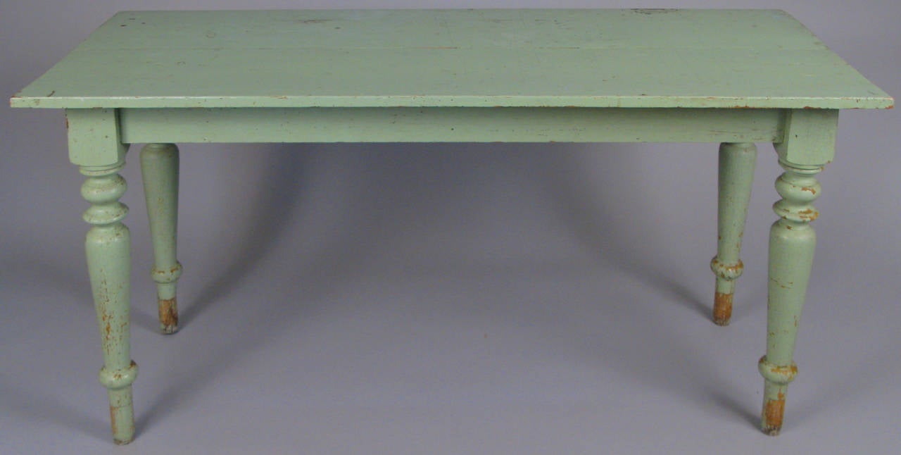 a late 19th century country table with lovley turned legs in its original beautiful green paint. small cut to one edge as shown. beautiful scale and proportions.