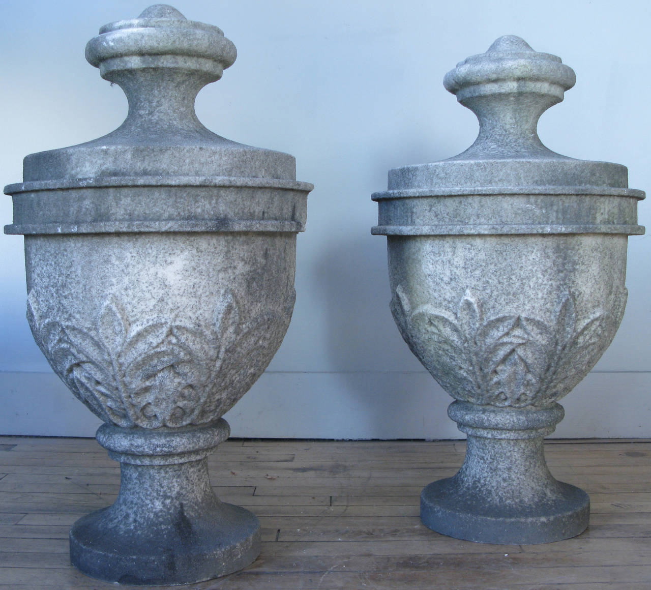 an impressive pair of large scale late 19th century carved marble garden finials, with flared bases and carved leaf design. beautiful aged patina.