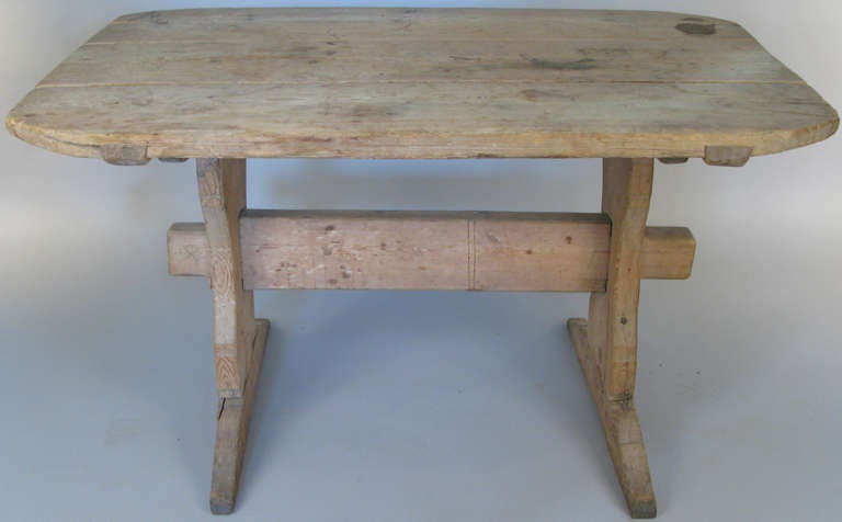 a very nice antique early 20th century swedish pine trestle table. classic form with a rectangular top with rounded corners.