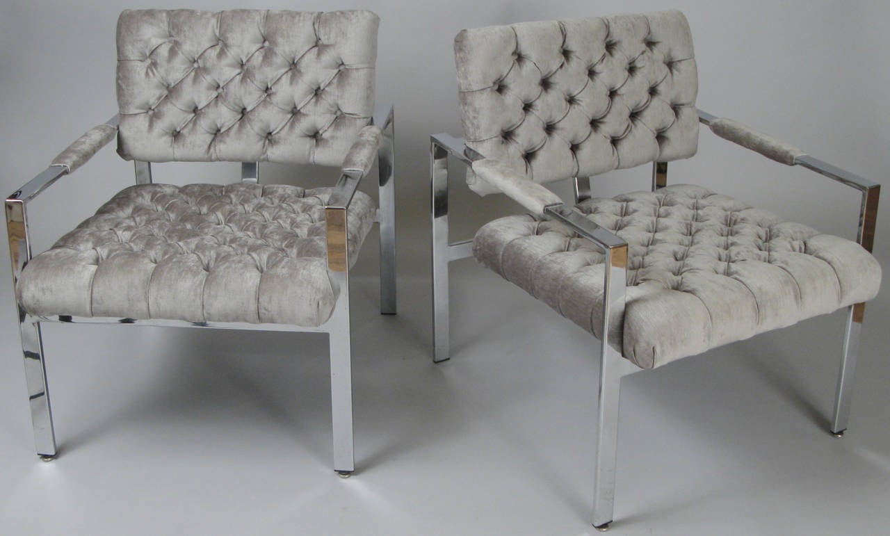A beautiful pair of vintage 1960s chrome lounge chairs by Milo Baughman, just reupholstered with fully button tufted seats and backs in a gorgeous grey-blue velvet. Very nice color and perfectly done.